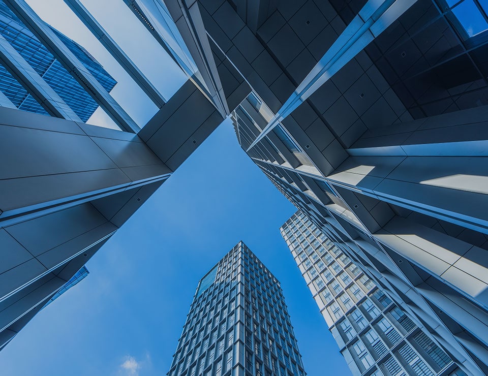 An image of buildings looking from the bottom up that is used for the MetaPerformance Business & Process Architecture service.